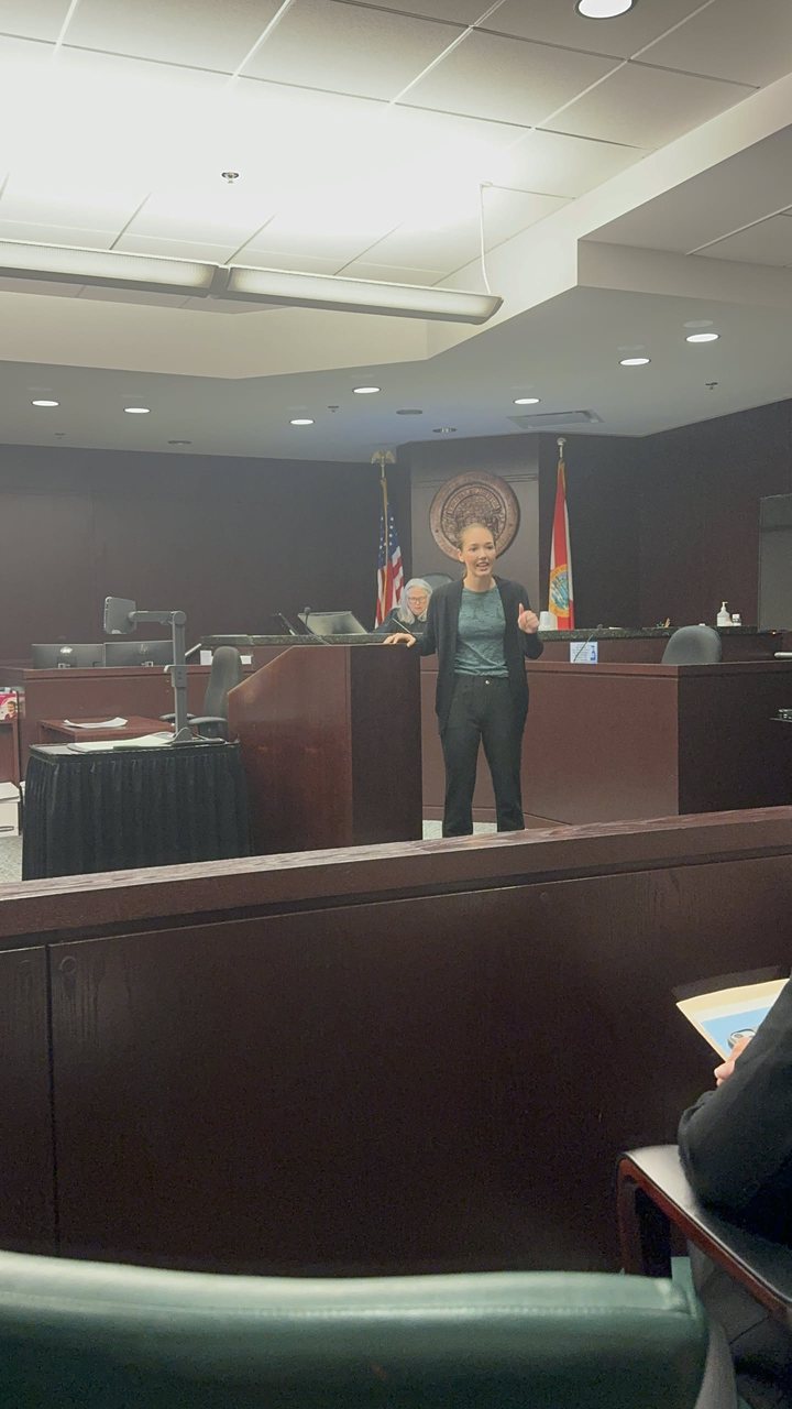 Jules addressing the court from the podium during mock trial